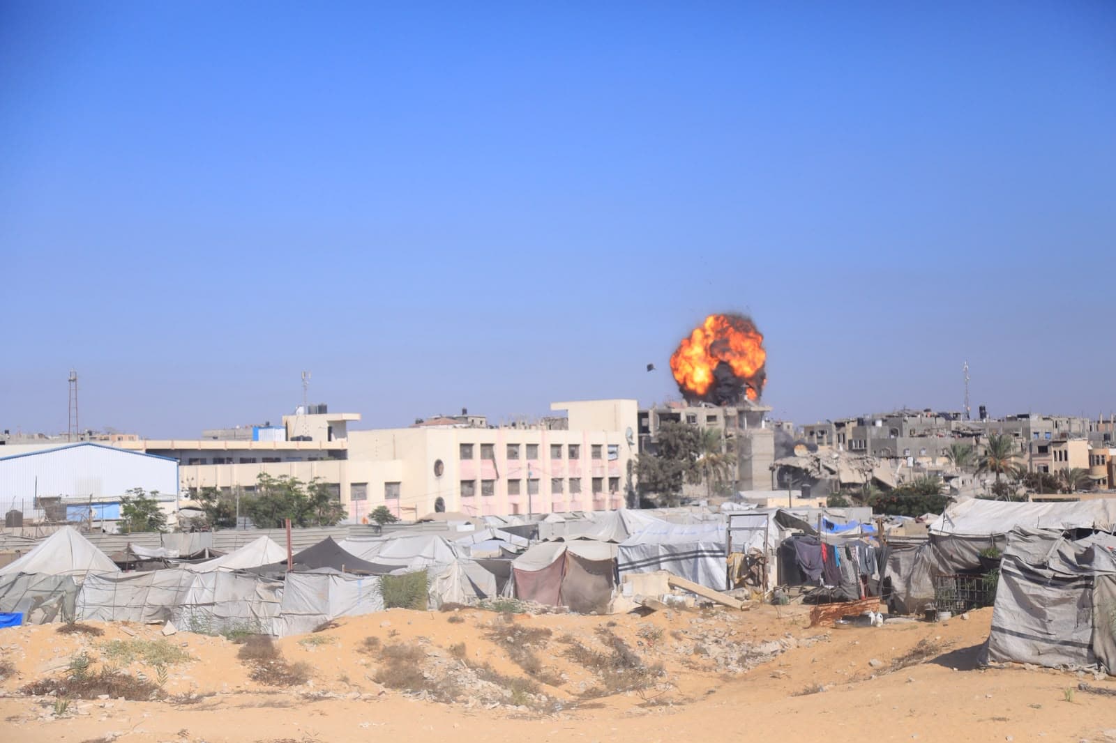 Occupation burns displaced persons' tents in Gaza