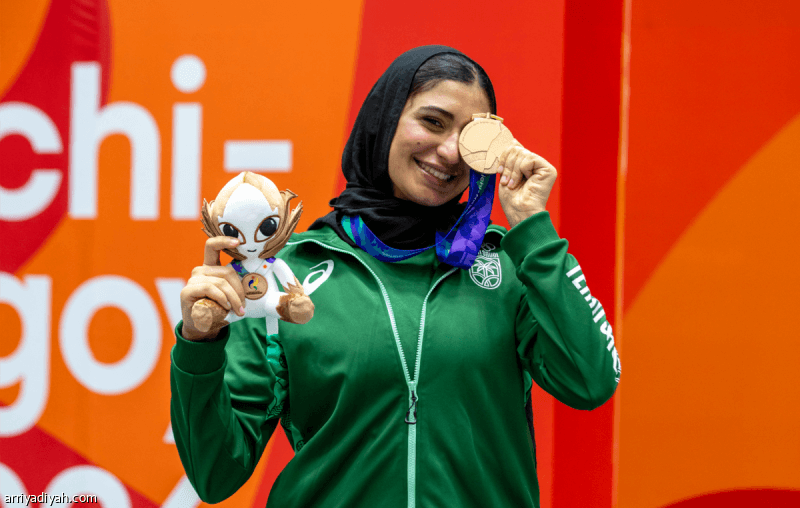 دينا تفوز بالميدالية النسائية الأولى في الألعاب