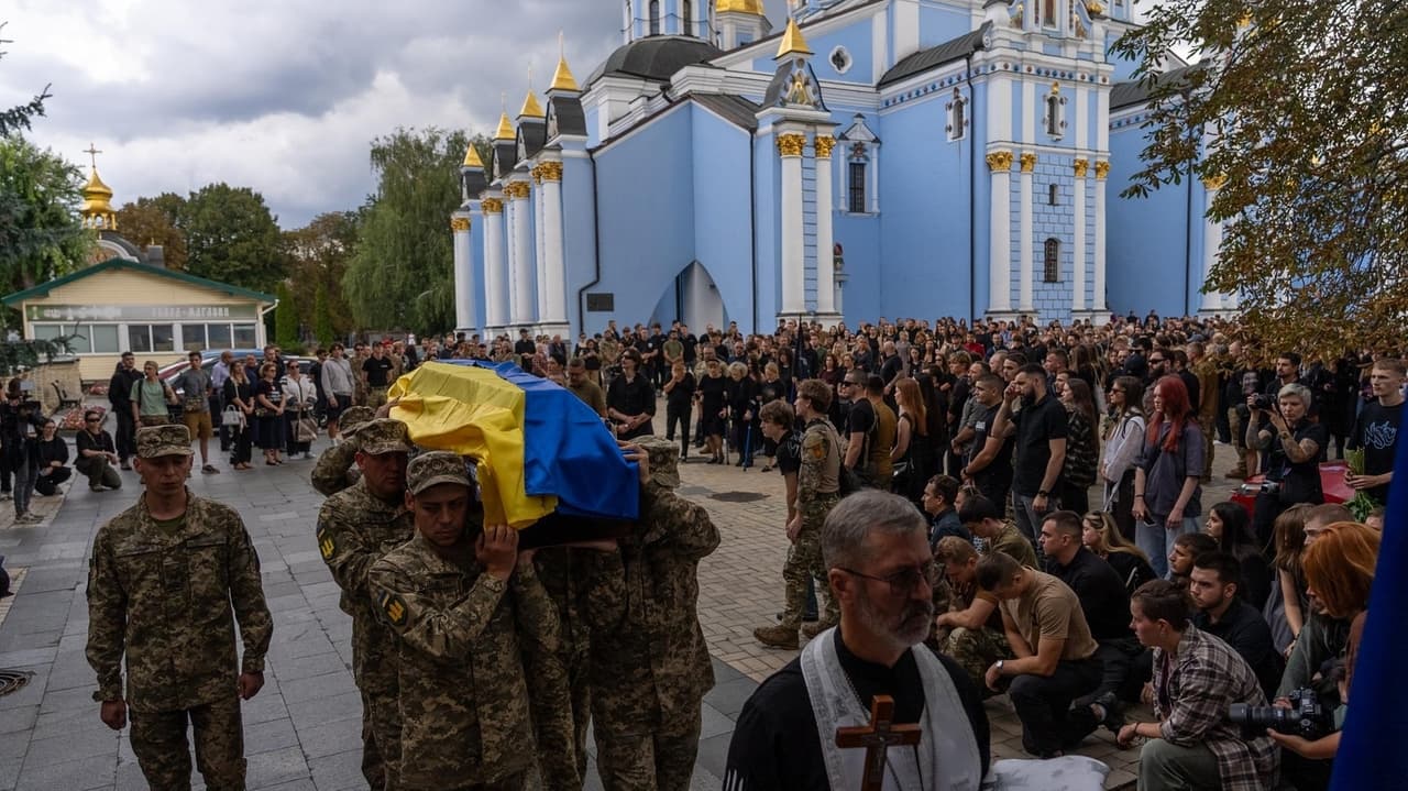 Pregnant soldier mourns husband's funeral