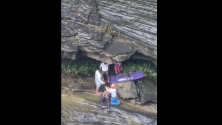 Tourists plunge from Thai waterfall