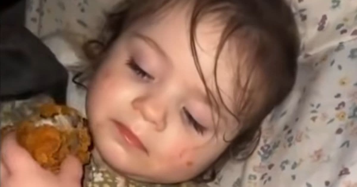 Girl sleeps hugging fried chicken