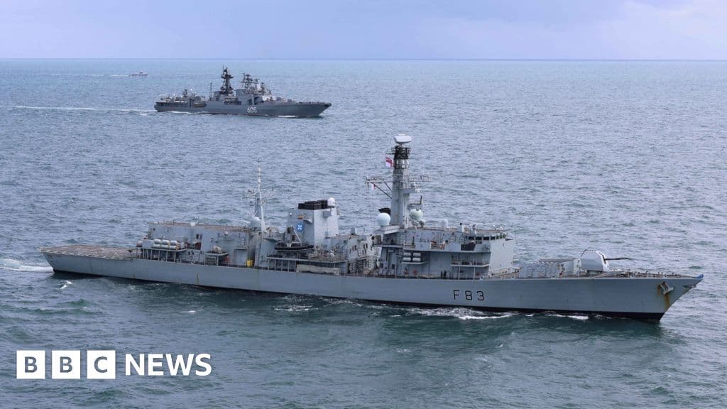 Navy ships and helicopter monitor Russian vessels