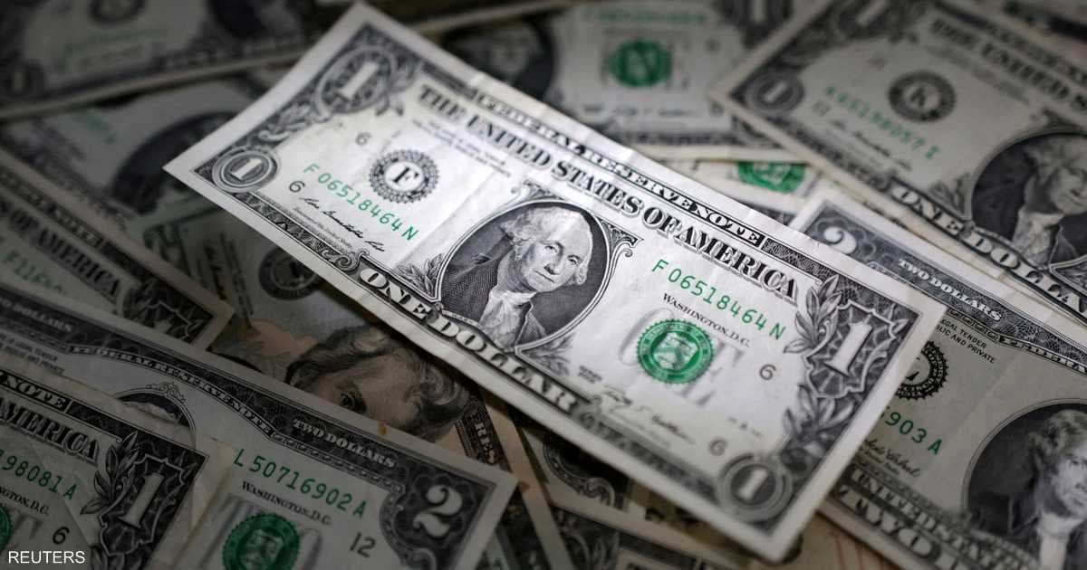 Dollar holds near two-week peak