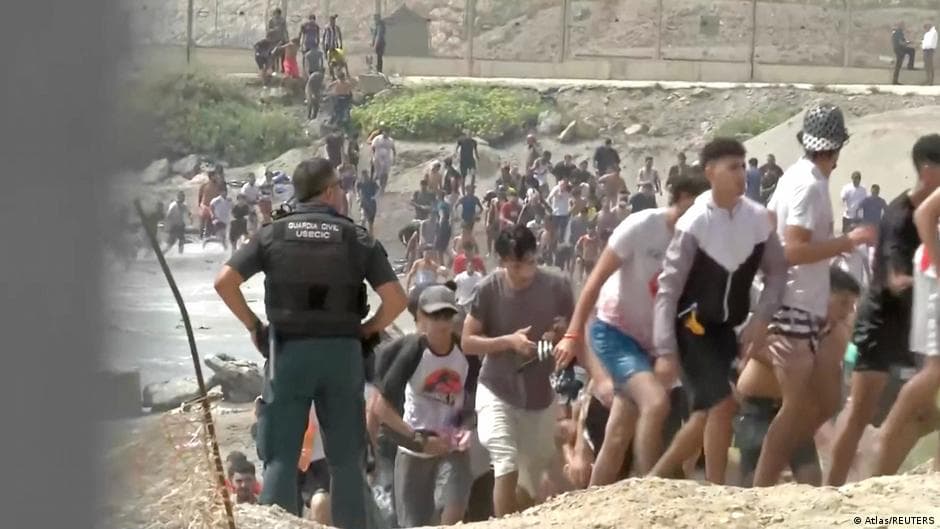 Migrants enter Ceuta from Morocco