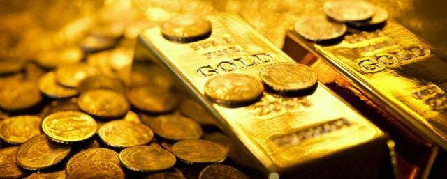 Gold rises on weak dollar and Fed move