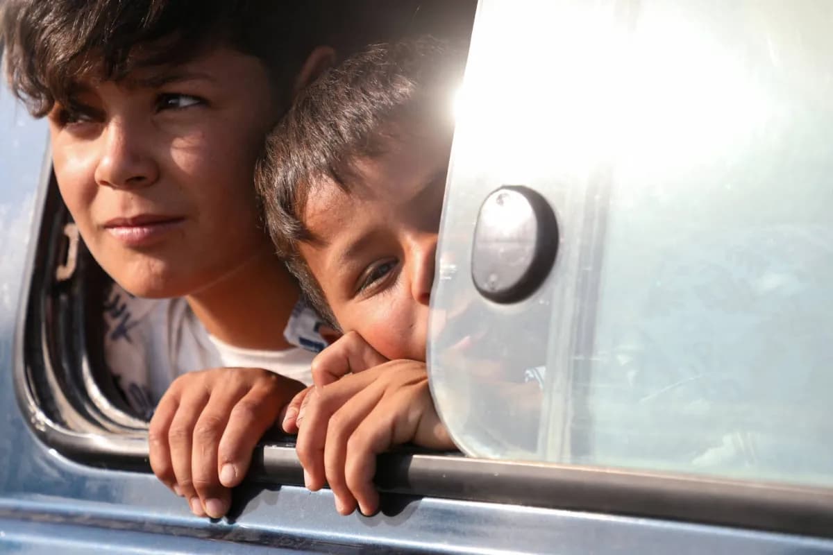 Displaced from Ras al-Ayn return after deal