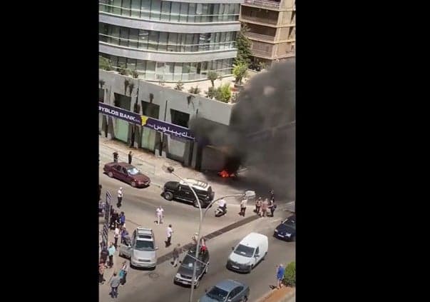 Protesters set fire outside Lebanon Bank in Sin el Fil