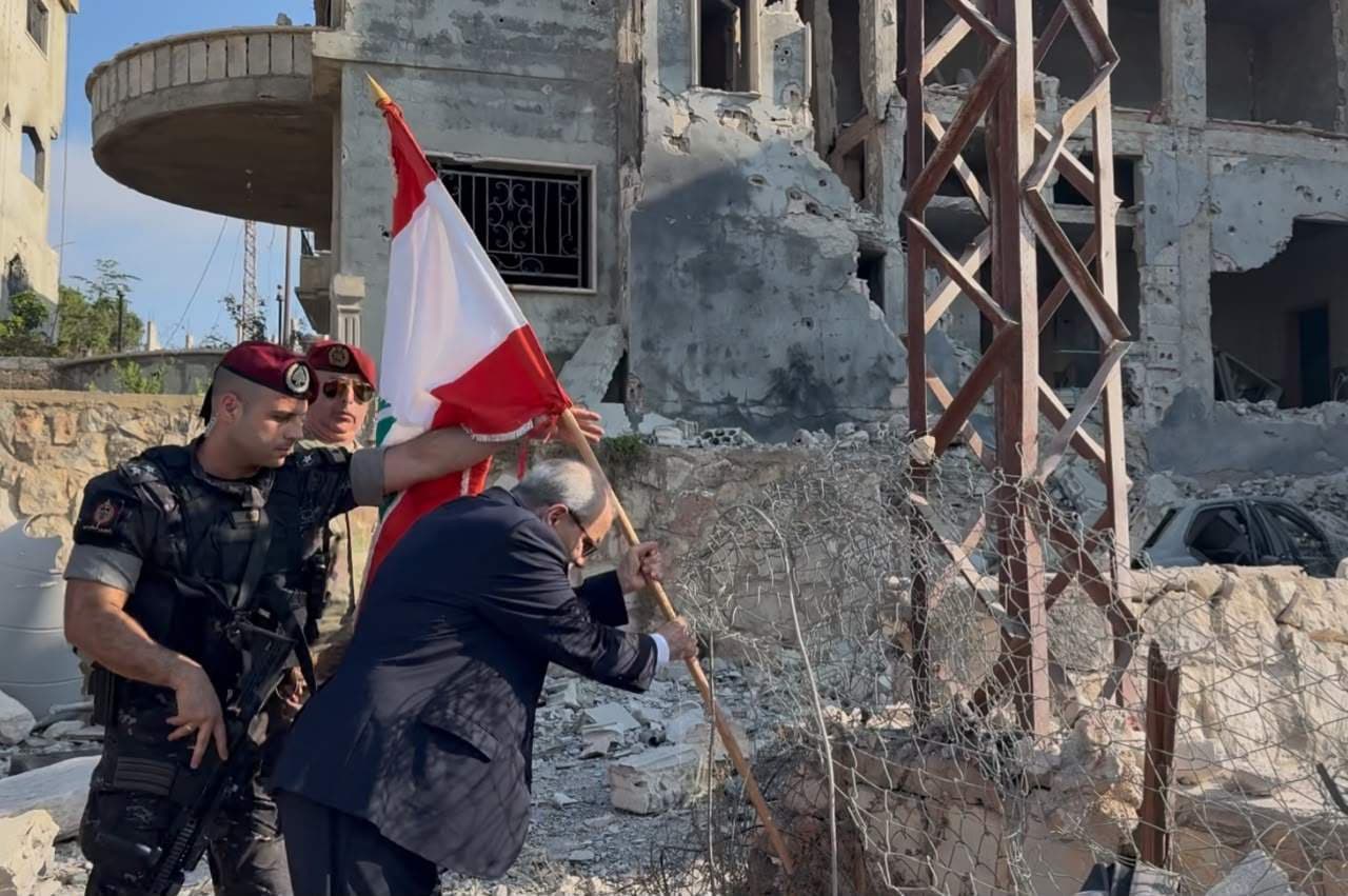 Peace plants Lebanese flag at Zoutr Square