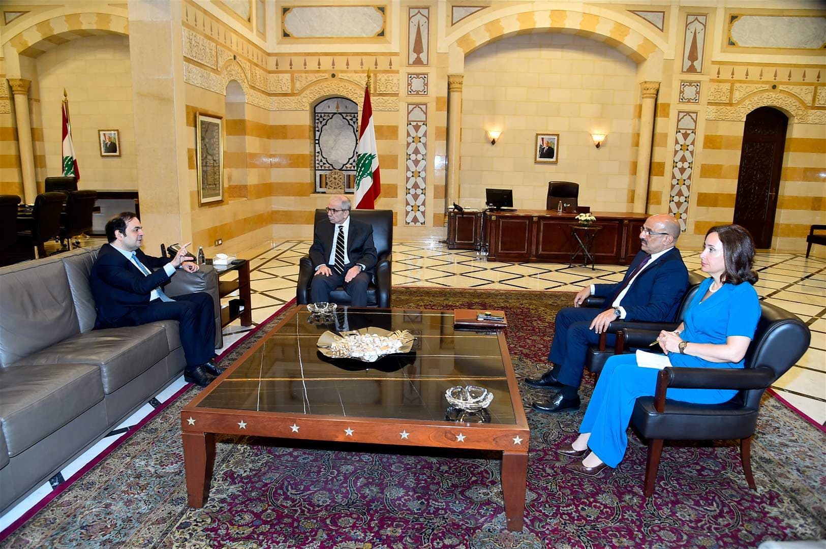 Tripoli buildings damaged on Salam's desk