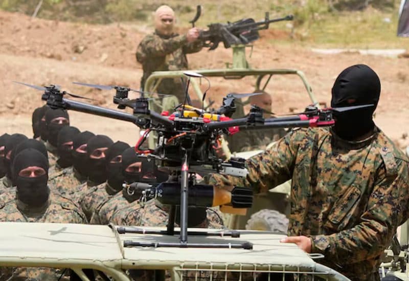 Assad-linked group and Hezbollah target Syrian security sites
