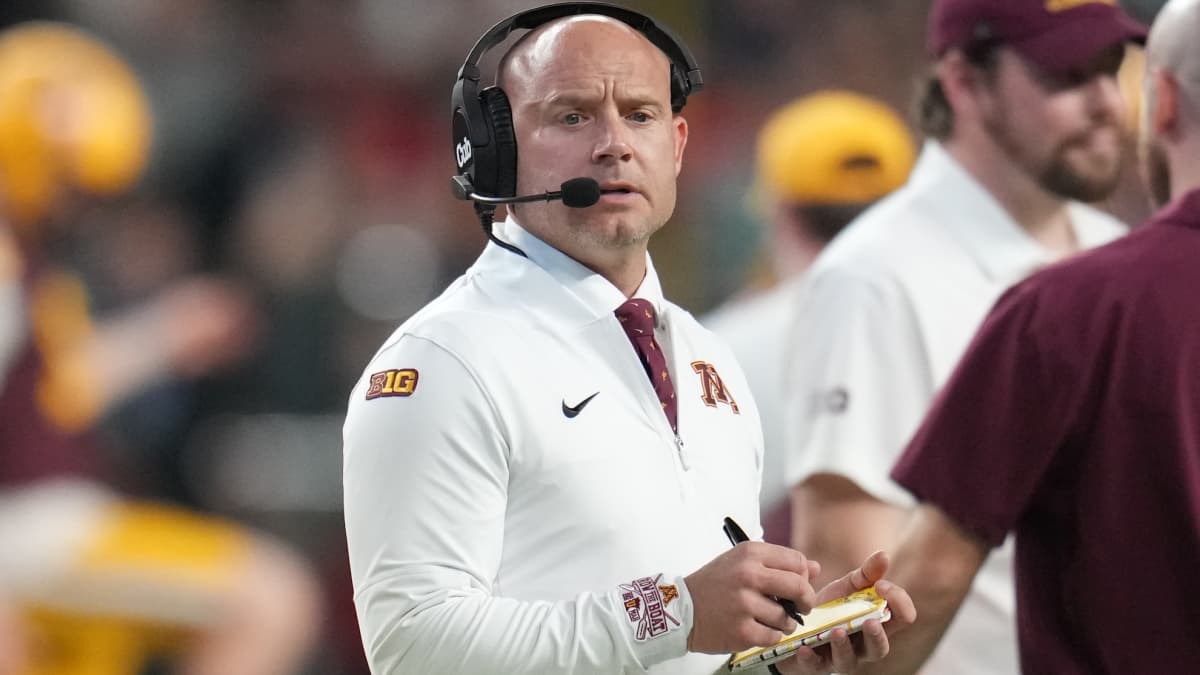 Minnesota’s P.J. Fleck wipes bloody lip onto his face