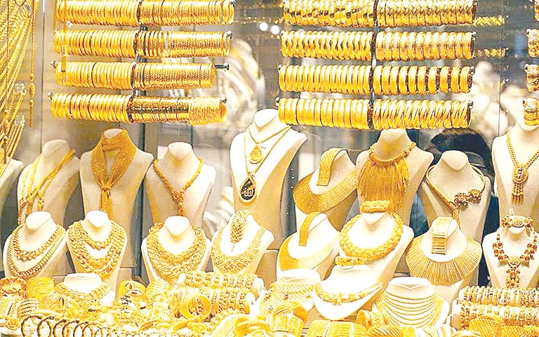 Gold climbs as oil gains slow amid US-Iran talks